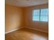 Bedroom with peach walls and wood-look flooring at 5234 Maroney Mill Rd, Douglasville, GA 30134