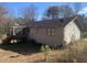 Rear view of the house, showcasing a screened porch and deck at 5234 Maroney Mill Rd, Douglasville, GA 30134