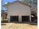 Two-car garage with concrete driveway and access to back deck at 5234 Maroney Mill Rd, Douglasville, GA 30134