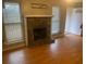 Living room with hardwood floors and stone fireplace at 5234 Maroney Mill Rd, Douglasville, GA 30134