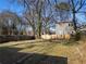 Large backyard with trees and a modern home in view at 1639 Stokes Sw Ave, Atlanta, GA 30310