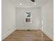 Well-lit bedroom with hardwood floors and a window at 1639 Stokes Sw Ave, Atlanta, GA 30310