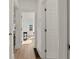 Bright hallway with hardwood floors and access to other rooms at 1639 Stokes Sw Ave, Atlanta, GA 30310