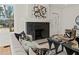 Living room with fireplace, hardwood floors and stylish decor at 1639 Stokes Sw Ave, Atlanta, GA 30310