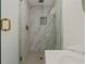 Large marble shower with glass enclosure and rainfall shower head at 1639 Stokes Sw Ave, Atlanta, GA 30310