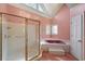 Bathroom with pink tile, a large tub and shower at 325 Yellowroot Ln, Sandy Springs, GA 30350