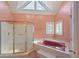 Bathroom with pink tile, a large tub and shower at 325 Yellowroot Ln, Sandy Springs, GA 30350