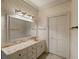 Bathroom with vanity, mirror and built-in storage at 325 Yellowroot Ln, Sandy Springs, GA 30350