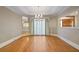 Formal dining room with hardwood floors, chandelier, and large window at 325 Yellowroot Ln, Sandy Springs, GA 30350