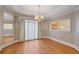 Bright dining room with hardwood floors, chandelier and window coverings at 325 Yellowroot Ln, Sandy Springs, GA 30350