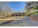 House with long driveway and mature trees at 325 Yellowroot Ln, Sandy Springs, GA 30350