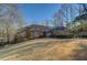 Brick home on a large lot with mature trees at 325 Yellowroot Ln, Sandy Springs, GA 30350