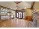 Gathering room with vaulted ceiling, hardwood floors, fireplace and kitchen views at 325 Yellowroot Ln, Sandy Springs, GA 30350