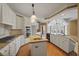 Spacious kitchen featuring granite countertops and island at 325 Yellowroot Ln, Sandy Springs, GA 30350