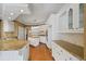 Island kitchen with granite countertops and white cabinets at 325 Yellowroot Ln, Sandy Springs, GA 30350