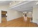 Open living room with hardwood floors and views to other rooms and backyard at 325 Yellowroot Ln, Sandy Springs, GA 30350