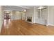 Spacious living room featuring hardwood floors, a fireplace, and built-in shelving at 325 Yellowroot Ln, Sandy Springs, GA 30350