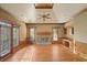 Bright living room featuring hardwood floors, fireplace and access to deck at 325 Yellowroot Ln, Sandy Springs, GA 30350