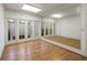 Spacious exercise room with hardwood floors and mirrored walls at 325 Yellowroot Ln, Sandy Springs, GA 30350