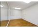 Bright exercise room with hardwood floors and mirrored wall at 325 Yellowroot Ln, Sandy Springs, GA 30350