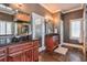 Elegant bathroom with dark wood cabinets and a large tiled shower at 531 Sweetfern Ln, Sugar Hill, GA 30518