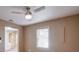 Bright bedroom with ceiling fan and large window at 531 Sweetfern Ln, Sugar Hill, GA 30518