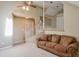 Bonus room with a brown couch and staircase at 531 Sweetfern Ln, Sugar Hill, GA 30518