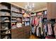 Custom closet with abundant shelving, drawers, and hanging rods at 531 Sweetfern Ln, Sugar Hill, GA 30518