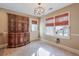 Dining area with built-in hutch and view to backyard at 531 Sweetfern Ln, Sugar Hill, GA 30518