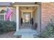 Inviting front entry with stone accents and covered porch at 531 Sweetfern Ln, Sugar Hill, GA 30518