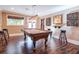 Game room with pool table, bar stools, and wet bar at 531 Sweetfern Ln, Sugar Hill, GA 30518