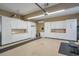 Organized garage with ample storage cabinets and work bench at 531 Sweetfern Ln, Sugar Hill, GA 30518