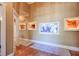 Elegant hallway featuring a built-in aquarium and hardwood floors at 531 Sweetfern Ln, Sugar Hill, GA 30518