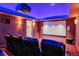 Home theater with large projection screen and theater seating at 531 Sweetfern Ln, Sugar Hill, GA 30518