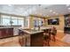 Gourmet kitchen features a sizable island with sink, breakfast bar, and stainless steel appliances at 531 Sweetfern Ln, Sugar Hill, GA 30518