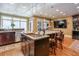 Island kitchen features stainless steel appliances, custom cabinetry, and granite countertops at 531 Sweetfern Ln, Sugar Hill, GA 30518