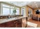 Modern kitchen with granite countertops and stainless steel appliances at 531 Sweetfern Ln, Sugar Hill, GA 30518