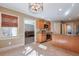 Kitchen with breakfast nook and view into living room at 531 Sweetfern Ln, Sugar Hill, GA 30518