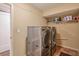 Basement laundry room with full-size washer and dryer at 531 Sweetfern Ln, Sugar Hill, GA 30518