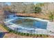 Community pool with safety cover and surrounding seating at 531 Sweetfern Ln, Sugar Hill, GA 30518