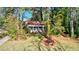 House with a front yard surrounded by tall trees at 610 Glenforest Rd, Sandy Springs, GA 30328