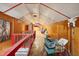 Unfinished attic space with wood paneling and storage at 610 Glenforest Rd, Sandy Springs, GA 30328