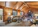 Cozy living room with wood paneled walls and a brick fireplace at 610 Glenforest Rd, Sandy Springs, GA 30328