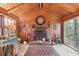 Wood paneled living room with brick fireplace at 610 Glenforest Rd, Sandy Springs, GA 30328