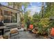 Stone patio with comfortable seating and lush greenery at 610 Glenforest Rd, Sandy Springs, GA 30328