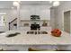 Kitchen island with granite countertop and double sink at 8235 Walnut Hall Dr, Fairburn, GA 30213