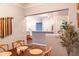 Bright dining area with a wooden table and chairs, offering a view into the living area at 10 Perimeter Summit Ne Blvd # 4315, Brookhaven, GA 30319