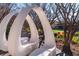 Unique white curved bench in a tree-lined outdoor setting at 10 Perimeter Summit Ne Blvd # 4315, Brookhaven, GA 30319