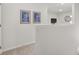 Upstairs hallway with simple decor and carpet at 3151 Greyton Dr, Buford, GA 30519