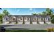 Row of inviting townhouses with stone and shingle accents at 3161 Greyton Dr, Buford, GA 30519